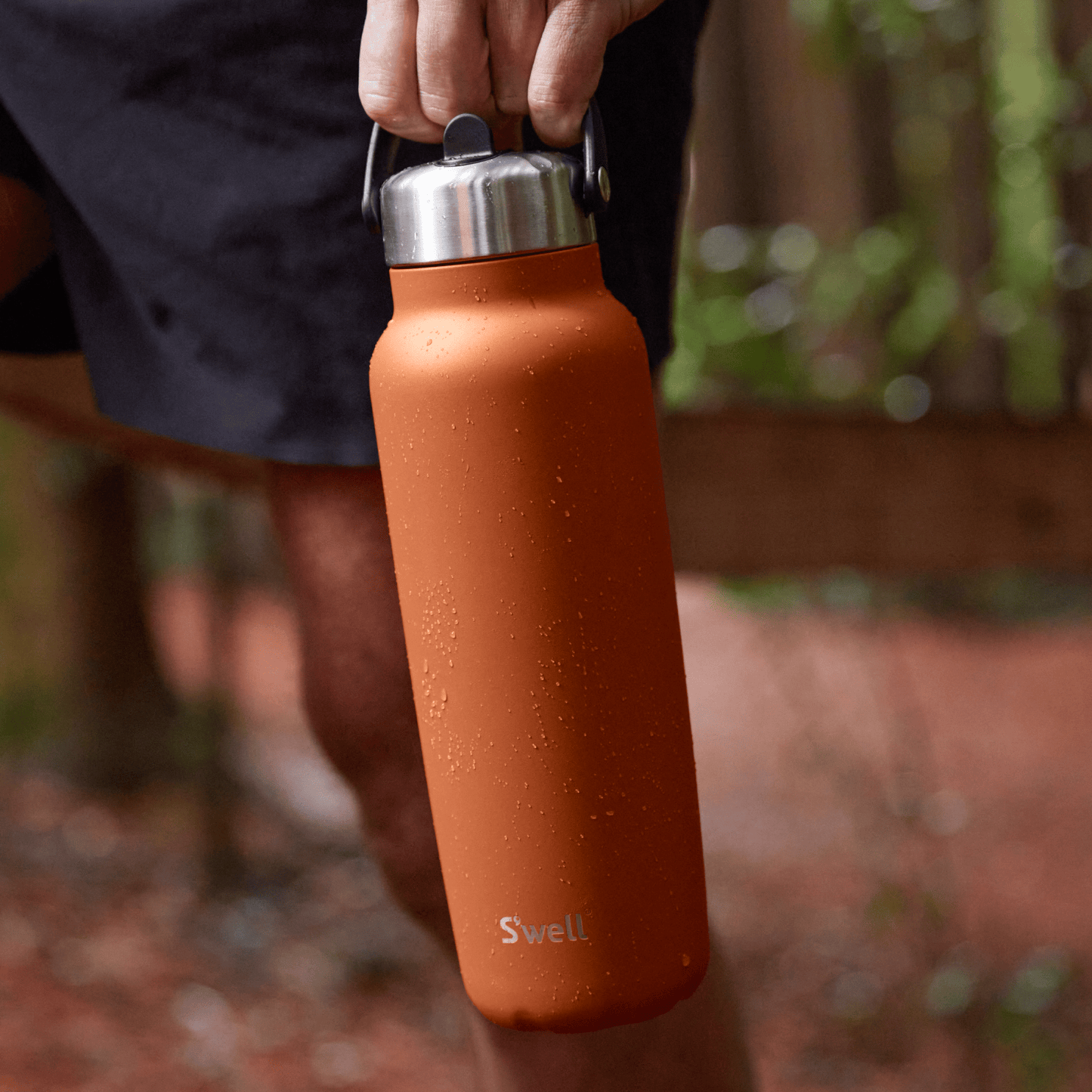 explorer-with-flip-straw-lid-40oz-q4 Swell-Explorer-Water-Bottle-40oz-Orange-Carnelian-LifeStyle.png
